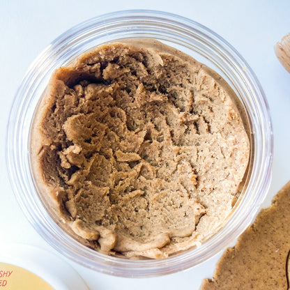 Light brown gingerbread playdough in a clear jar.